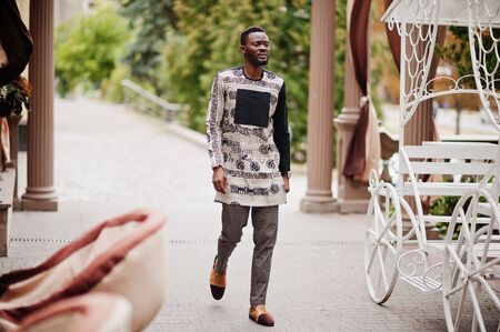 Handsome afro american man wearing traditional clothes in modern city.の写真素材