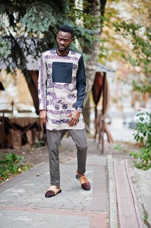 Handsome afro american man wearing traditional clothes in modern city.の写真素材