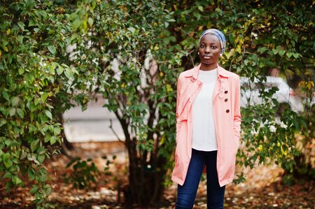 Young modern fashionable, attractive, tall and slim african muslim woman in hijab or turban head...
