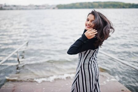 Portrait of young beautiful indian or south asian teenage girl in dress.