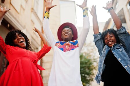Group of three stylish trendy afro france friends posed at autumn day. Black african man model with...