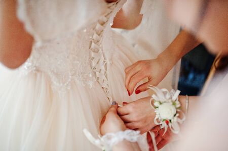 Morning of the bride preparation. Young and handsome bride at wedding day.の写真素材