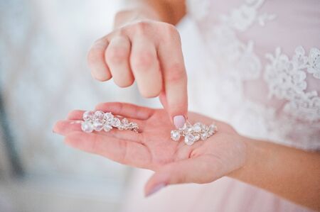 Wedding day. Accesories  for wedding preparation. Earrings.の写真素材