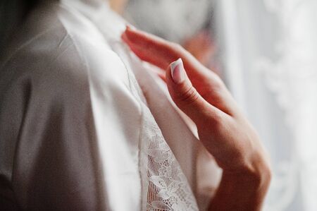 Morning of the bride preparation. Young and handsome bride at wedding day.