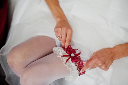 Morning of the bride preparation. Young and handsome bride at wedding day.の写真素材