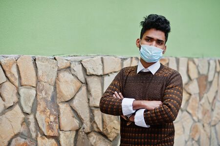 Coronavirus covid-19 concept. South asian indian man wearing mask for protect from corona virus.