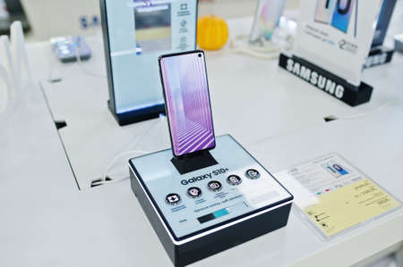 Kyiv, Ukraine - October 28, 2019: New Samsung Galaxy S10 + mobile smartphones are displayed on retail display in electronic store.のeditorial素材