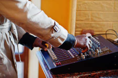 African american young sound producer working at studio.