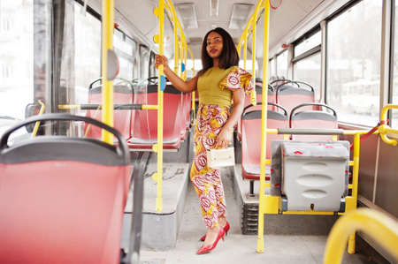 Young stylish african american woman riding on a bus.の写真素材