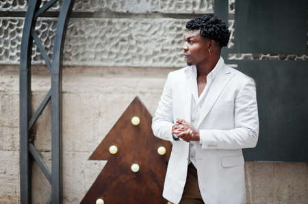 Thoughtful young handsome african american gentleman in formalwear. Black stylish model man in white...