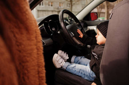 Young mother and child in car. Safety driving concept.の写真素材