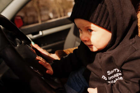 Young mother and child in car. Safety driving concept.
