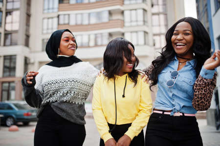 Three young college african american woman friends spend time together.の写真素材