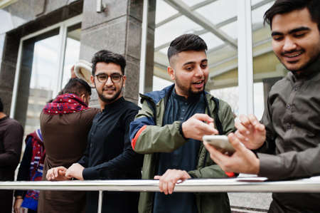 Group of pakistani man wearing traditional clothes salwar kameez or kurta.
