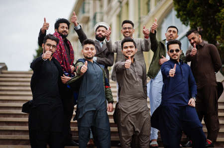 Group of pakistani man wearing traditional clothes salwar kameez or kurta.