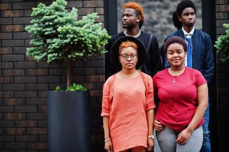 Four african friends having fun outdoors. Two black girls with guys.の写真素材