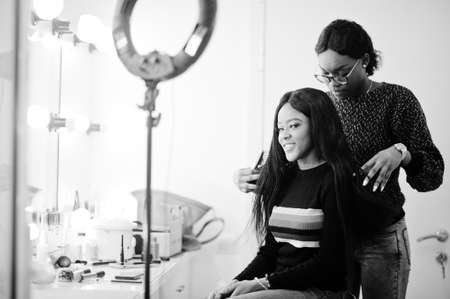 African American woman applying hairdresser or hairstylist at beauty saloon.の写真素材