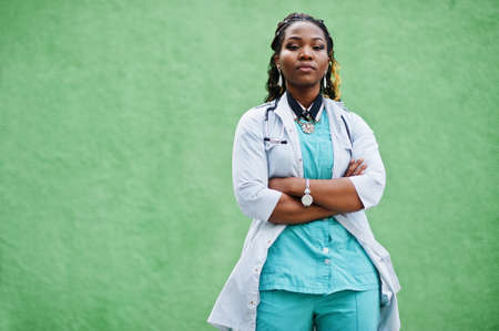 Portrait of African American female doctor with stethoscope wearing lab coat.の写真素材
