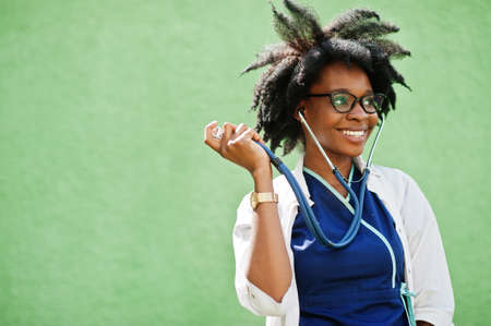 Portrait of African American female doctor with stethoscope wearing lab coat.