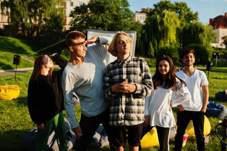 Young multi ethnic group of people in open air cinema.の写真素材