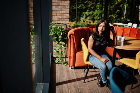 Fashionable african american woman at restaurant.