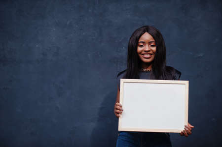 Fashionable african woman hold empty white board.の写真素材