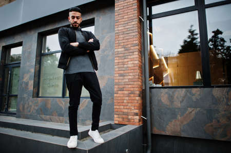 Portrait of stylish arab beard man wear gray turtleneck and black jaket. Arabian model guy.の写真素材