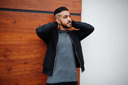 Portrait of stylish arab beard man wear gray turtleneck and black jaket. Arabian model guy.の写真素材