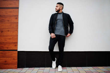 Portrait of stylish arab beard man wear gray turtleneck and black jaket. Arabian model guy.の写真素材