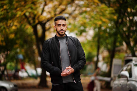 Portrait of stylish arab beard man wear gray turtleneck and black jaket. Arabian model guy on a...