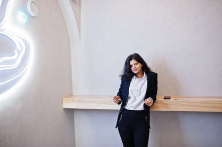 Gorgeous indian woman wear formal posing at cafe.
