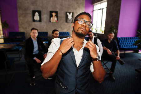 Stylish african american man against group of handsome retro well-dressed guys gangsters spend time...