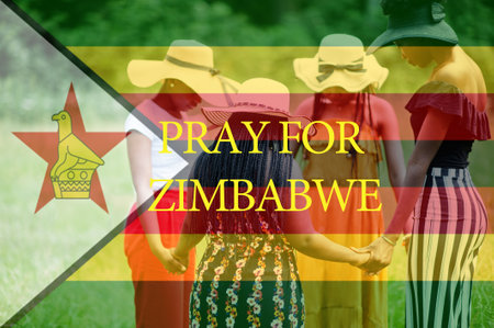 Pray for Zimbabwe. Group of four african women holding hands and praying. Concept of crisis in Africa country.の写真素材