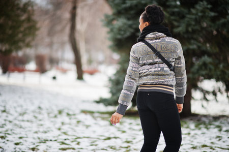 Back of african woman wear in black scarf pose in winter day at Europe.の写真素材