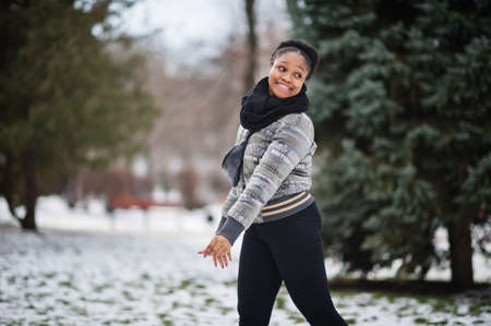 African woman wear in black scarf pose in winter day at Europe.の写真素材