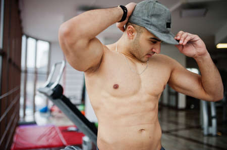 Fit and muscular arabian man posing in gym.の写真素材