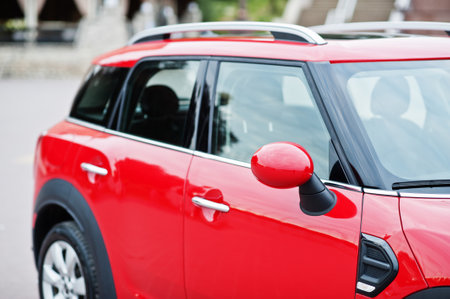 Mirror of red city car. Small car for cities.の写真素材