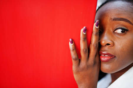 Eyes of a beautiful natural young African woman with afro hair.の写真素材