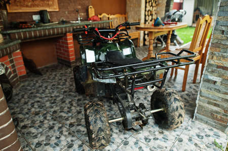 Four-wheller ATV quad bike in home use.