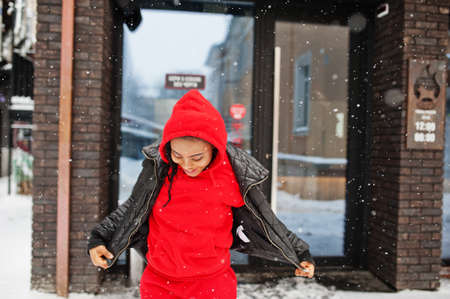 African american woman in red hoodie enjoy winter day.の写真素材