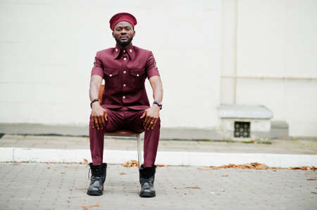 Portrait of African American military man in red uniform and beret.の写真素材
