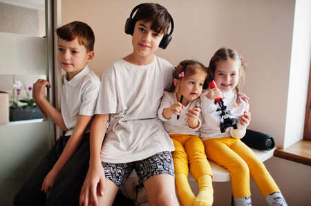 Kids using microscope learning science class at home.の写真素材