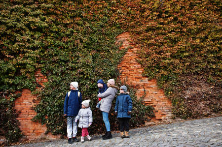 Family walking at historical Mikulov Castle, Moravia, Czech Republic. Old European town.