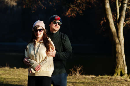 Couple in pound at early spring park.