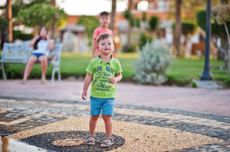 Young boy play at fountain on egyptian resort. Funny summer vacation.