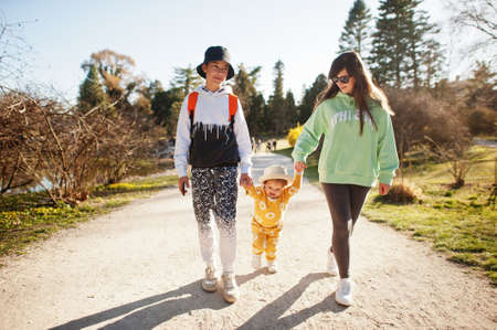 Mother with two kids at Lednice park, Czech Republic.