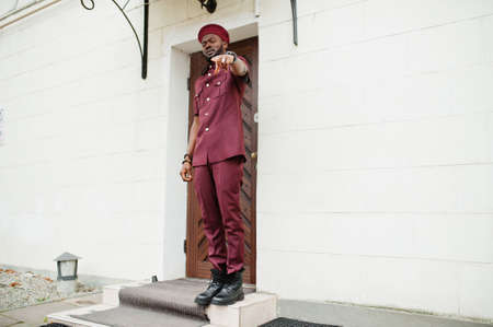 Portrait of African American military man in red uniform and beret.の写真素材