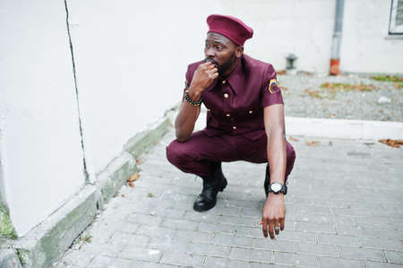 Portrait of African American military man in red uniform and beret.の写真素材