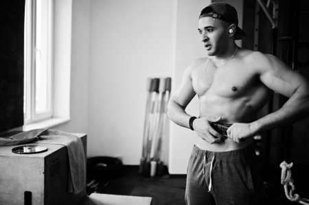 Fit and muscular arabian man doing workouts in gym.の写真素材