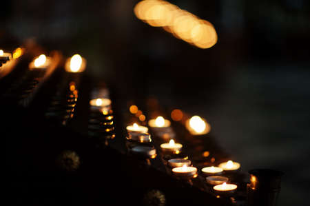Row of red lights church candles.の写真素材